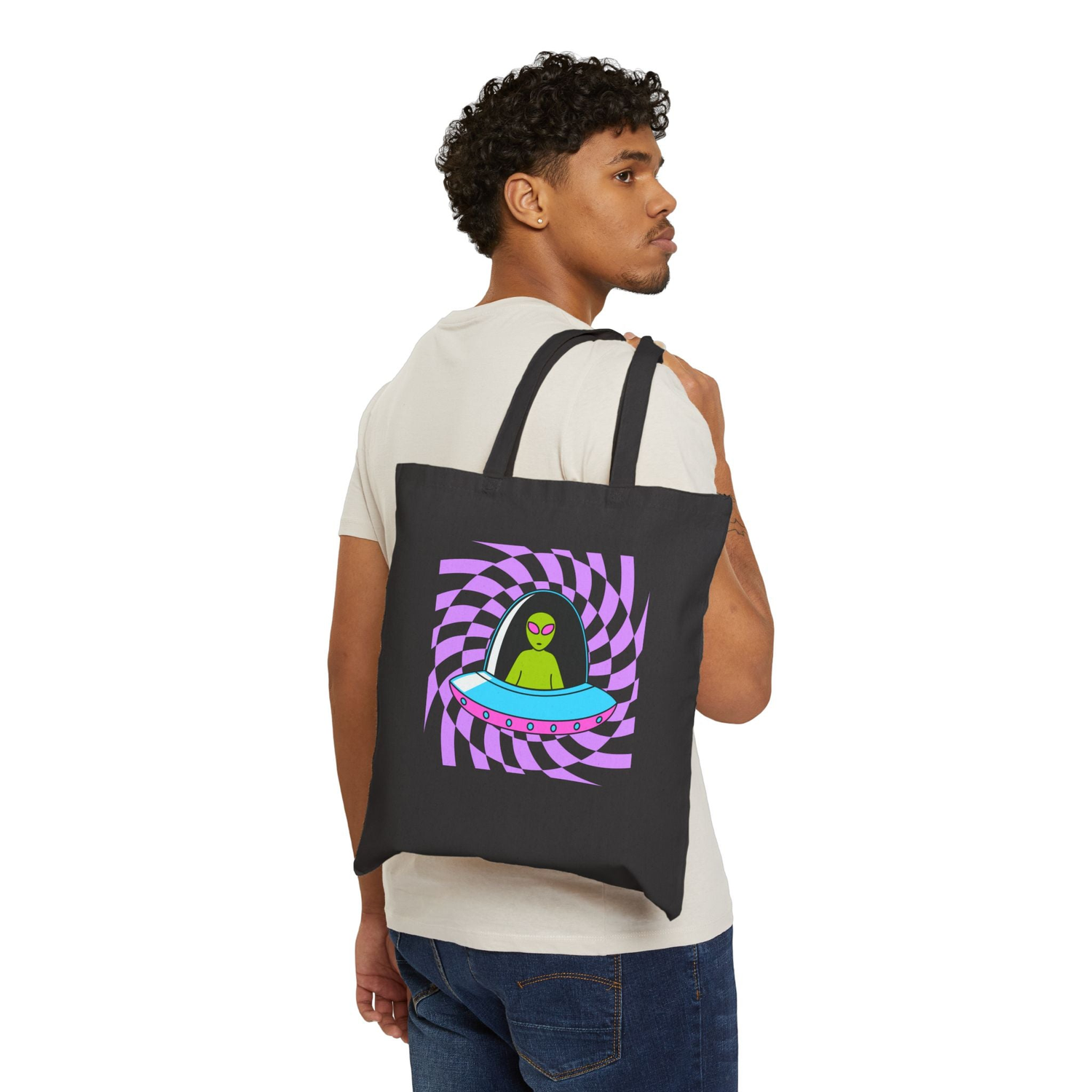 A beige tote bag displayed prominently against a solid black background, highlighting its color and design